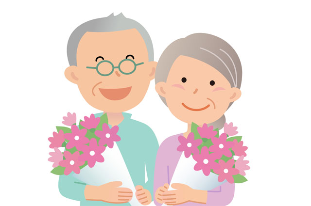 敬老の日にお花をもらうおじいちゃんとおばあちゃん